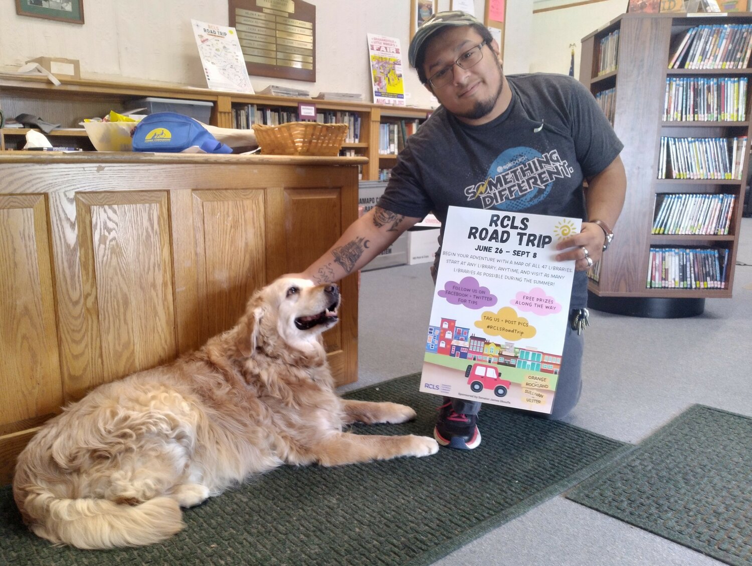 Michael Benedict recently visited the Sunshine Hall Free Library in Eldred, completing a tour of 47 area libraries. He was greeted by Camry, a volunteer at the library. ..